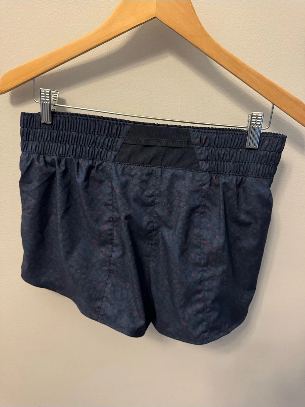 Nike Women’s Dark Navy Athletic Shorts with Subtle Red Print
